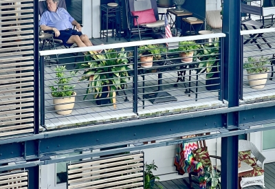 A cutaway view of the stacked porches showing personal touches added by residents