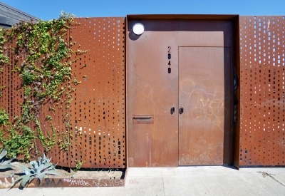 Cor-ten fence around the DBA_OAK courtyard.