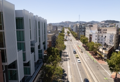 Balconies in foreground with view up Market Street toward Twin Peaks
