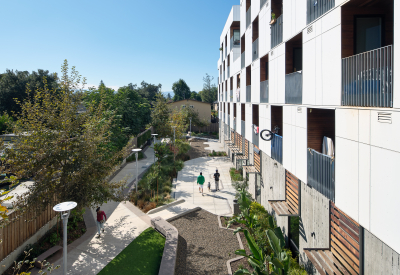 View from above of landscaped courtyard at white apartment building