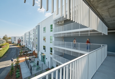 View from exterior hallway showing view down adjacent bike path