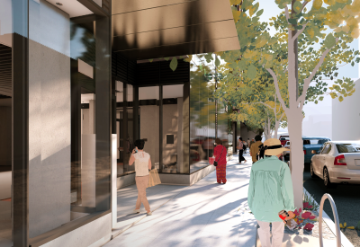 Building entrance canopy and sidewalk with tree and people