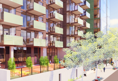 Paved outdoor space in front of building with balconies 