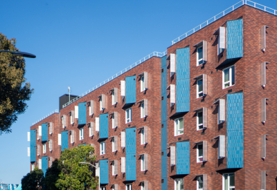 Blue brick accents enliven a red-brick facade