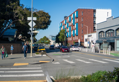 View of apartment building in neighborhood context