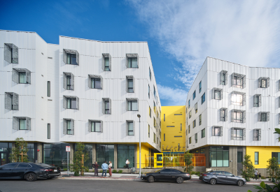 Street view of white apartment buildings