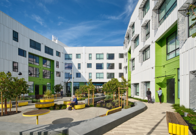 Overall view shows white volumes and glass volume in foreground