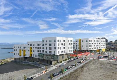Aerial view showing apartment buildings and water's edge