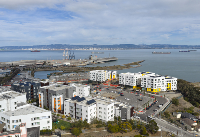 Aerial view showing apartment buildings and water's edge