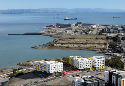 Aerial view shows the full three-phase development and water's edge