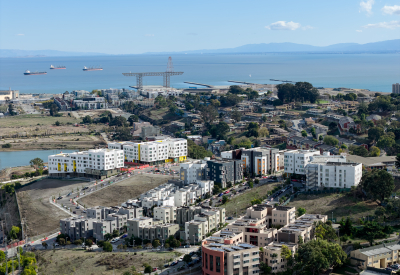 Aerial view showing apartment buildings and water's edge