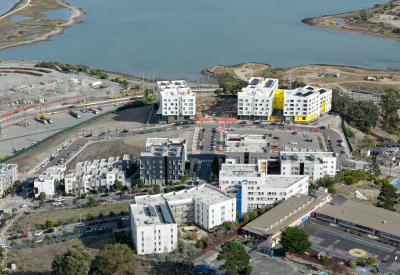 Aerial view showing apartment buildings and water's edge