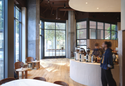 A white shape defines the ceiling over the ordering counter