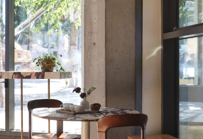 Daylight streans into the shop from the floor to ceiling windows