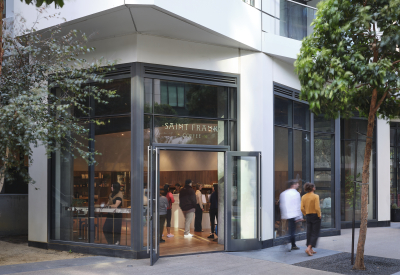 A street view of the small coffee shop at the base of the Mira tower