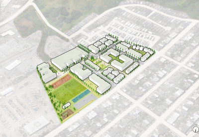 Aerial view of multi-block site with varying housing types