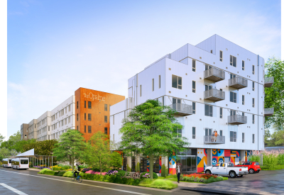 White building in foreground with orange in the background