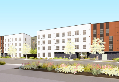 Rendering view of a long four-story building with a distinctive rounded massing at the right corner.