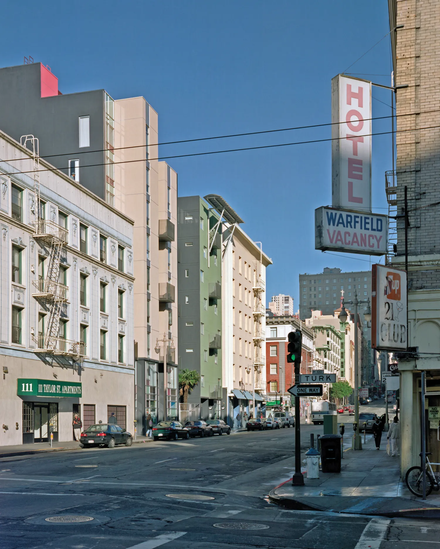 Curran House in context, seen between historic buildings. 