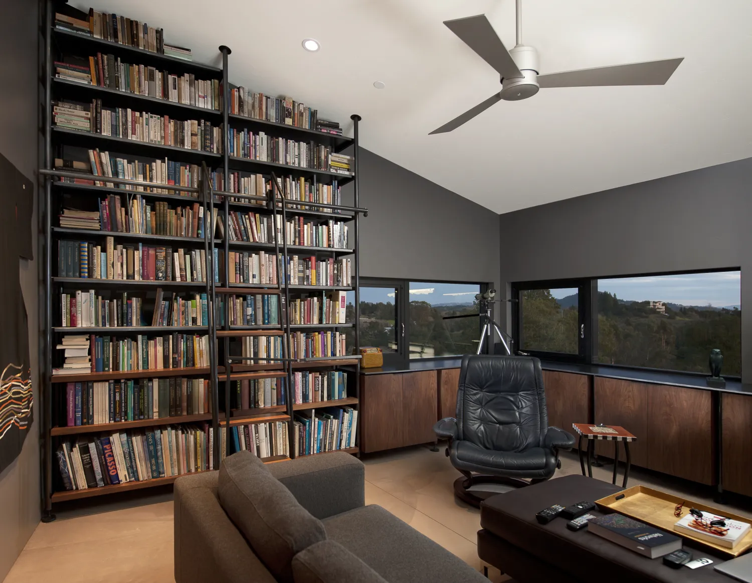 Wall to ceiling book cases in a study at Healdsburg Rural House in Healdsburg, California.