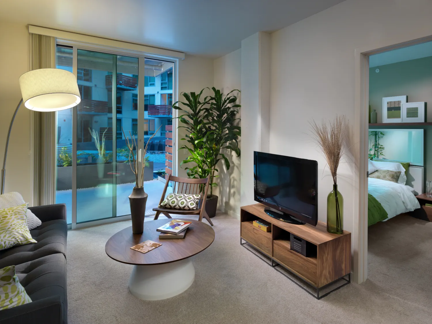 Interior view of a unit living room and bedroom at Rincon Green in San Francisco.