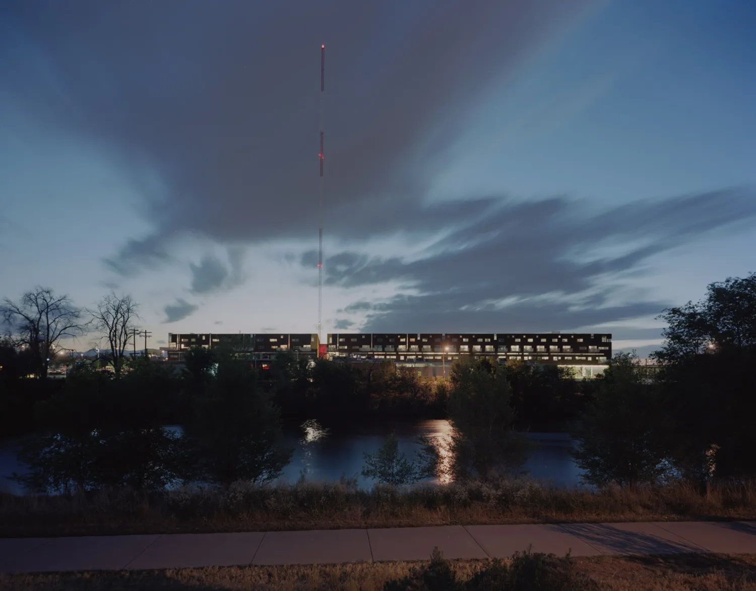 River with Taxi 2 in the background at night  in Denver, Colorado. 