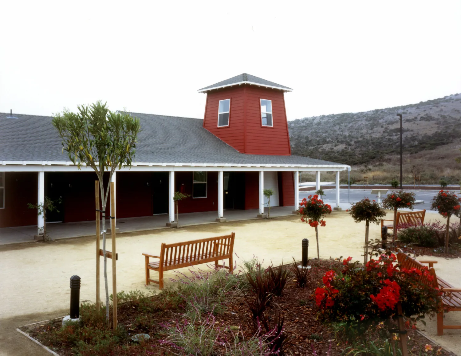 Courtyard with benches in front of the community building Moonridge Village in Santa Cruz, California.