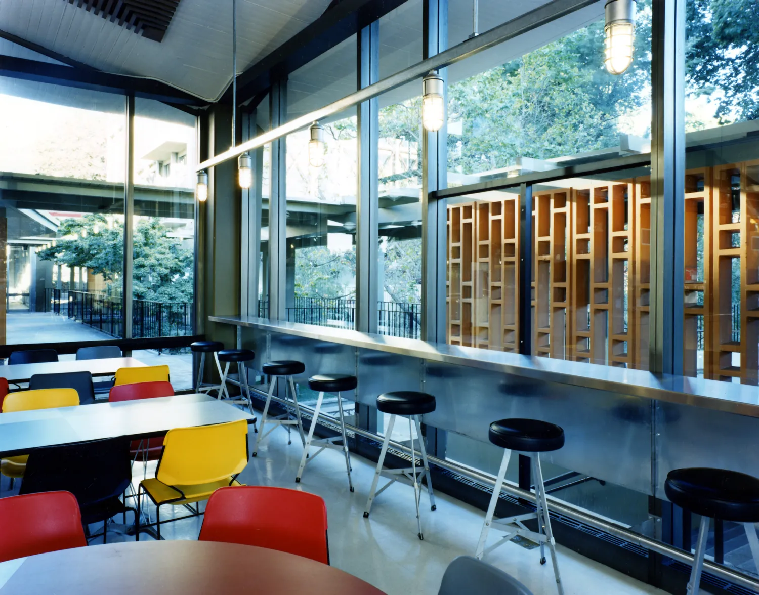Interior view of U.C. Berkeley Dining Halls with counter and table seating.