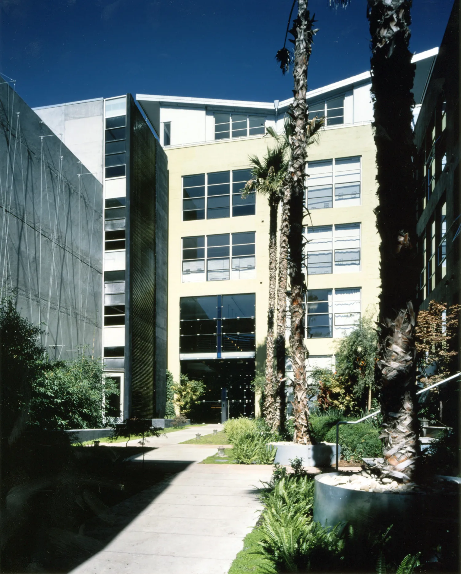 Exterior view of the entry courtyard to 1500 Park Avenue Lofts in Emeryville, California.