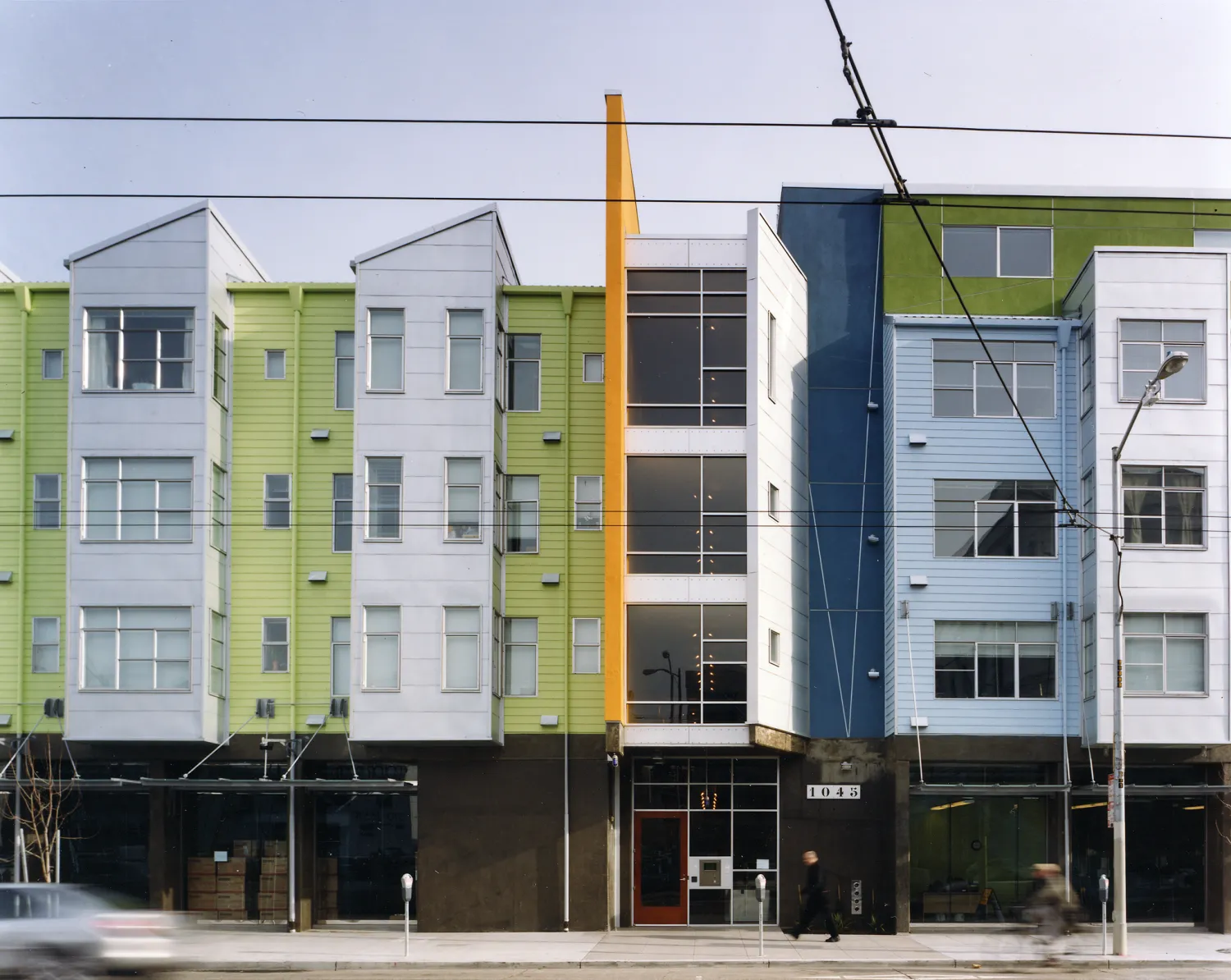 Exterior elevation with retail spaces at SOMA Residences in San Francisco.