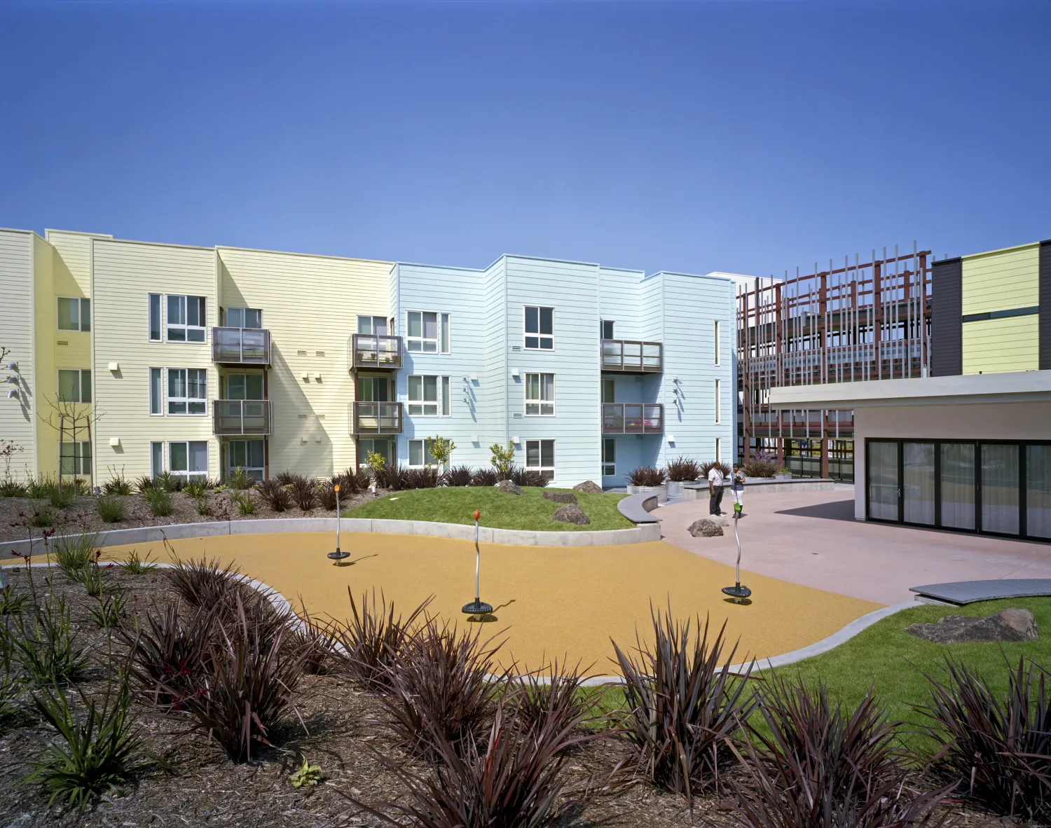 Exterior view of residential courtyard at Ironhorse at Central Station in Oakland, California.