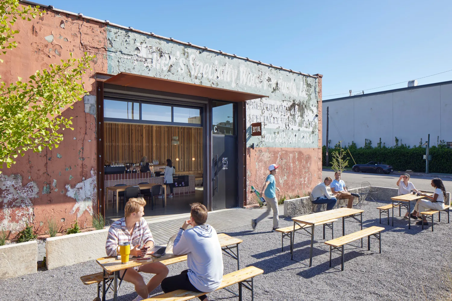 View of multiple people enjoying the open courtyard at the Bandsaw Building in Birmingham, Alabama.