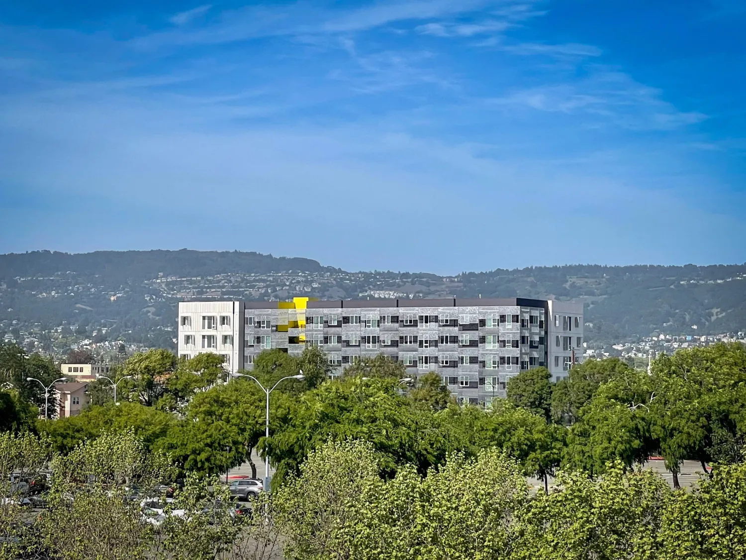 Exterior view of Coliseum Place from a distance in Oakland, California.