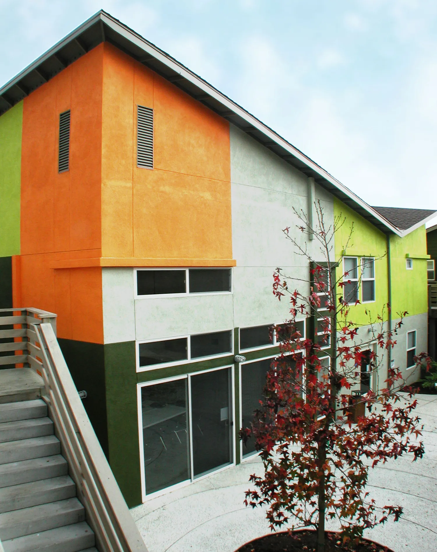 Exterior view of the colorful community building at Stoney Pine Villa in Sunnyvale, California.