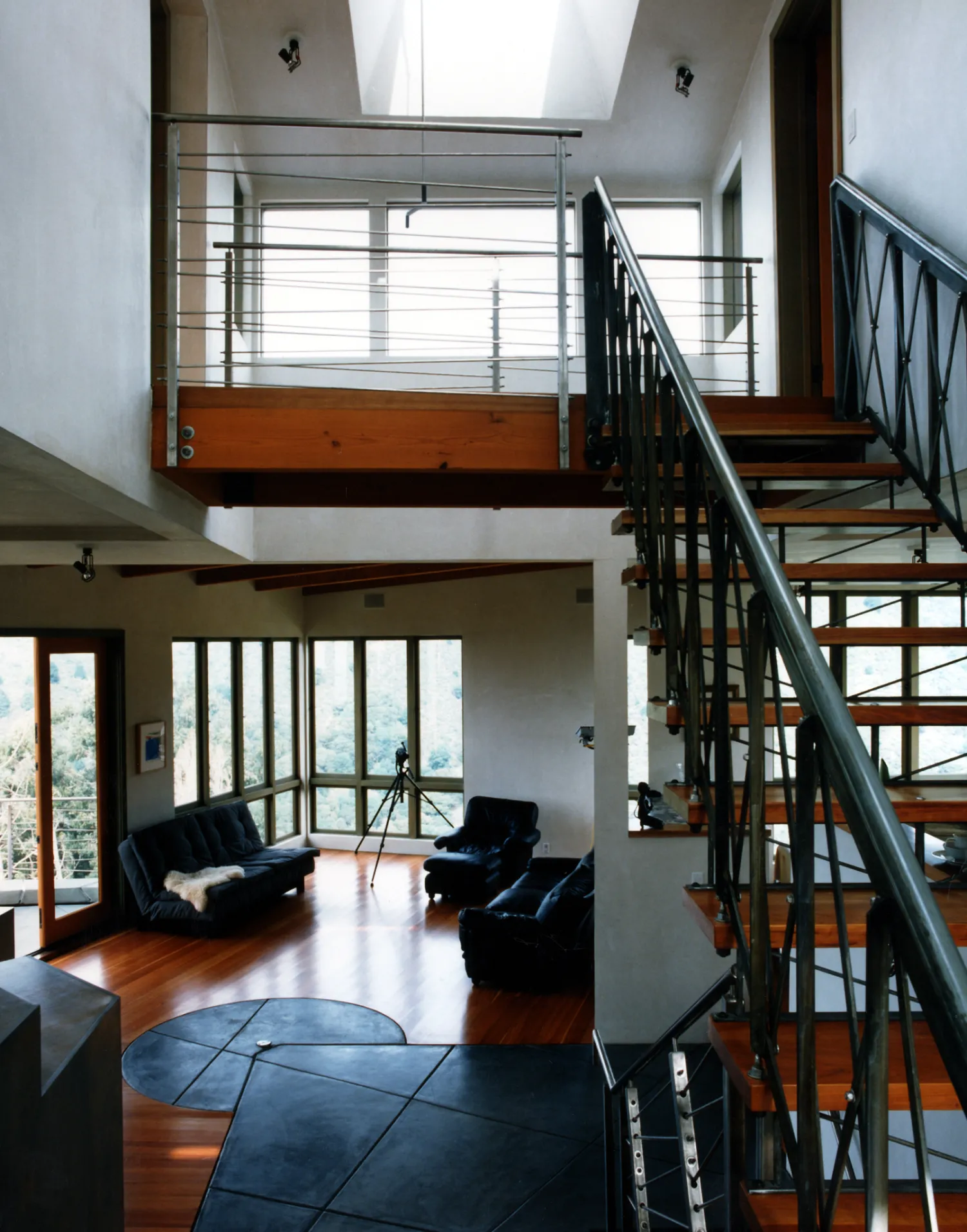 Interior view of the living room and custom stairs at Kayo House in Oakland, California.