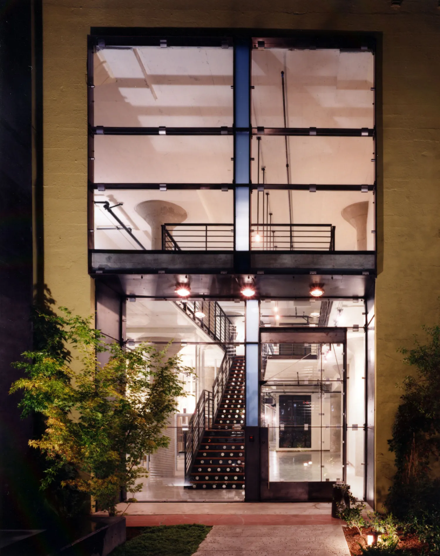 Glass entry door at 1500 Park Avenue Lofts in Emeryville, California.