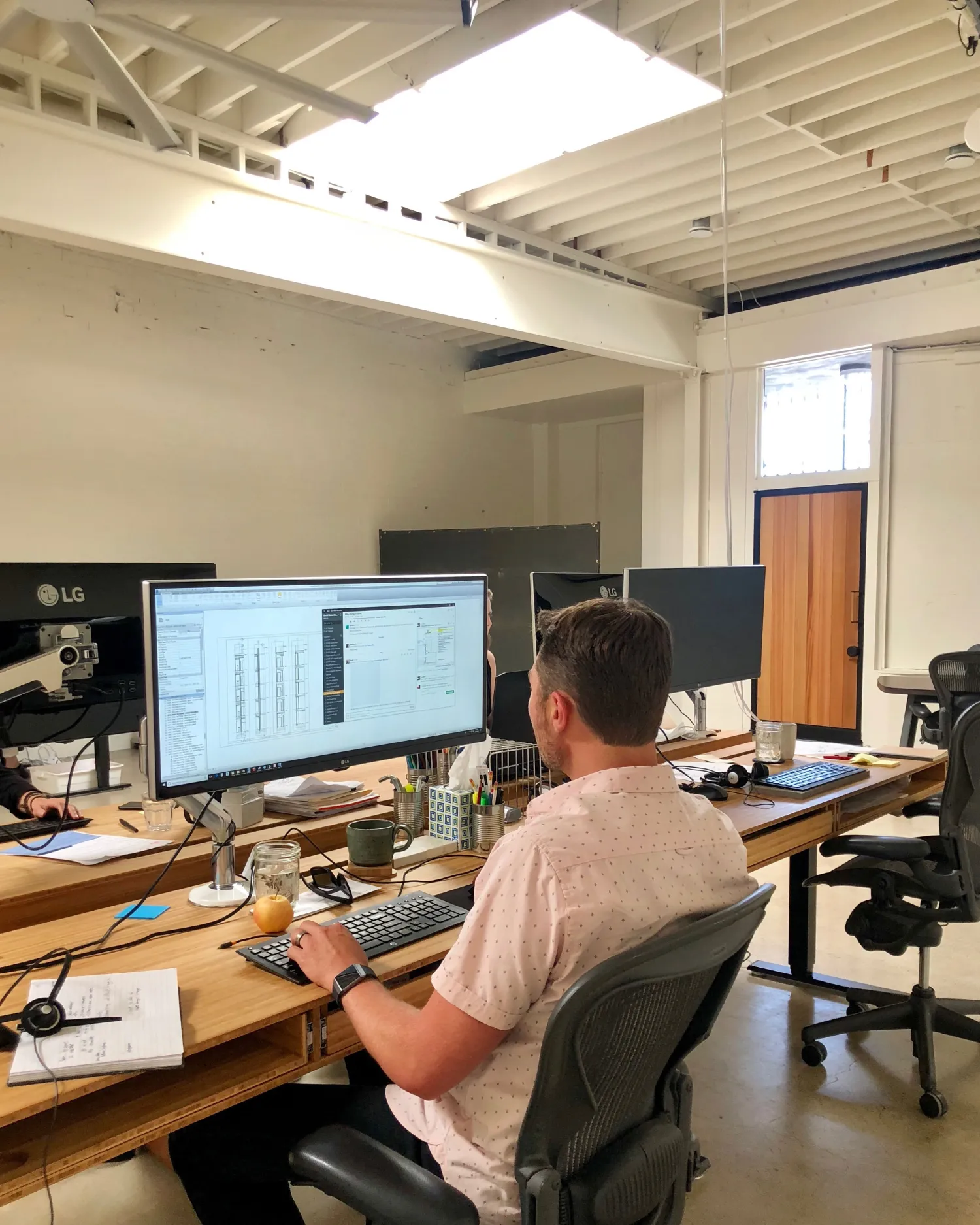 Staff working in the David Baker Architects Office in Oakland, California.