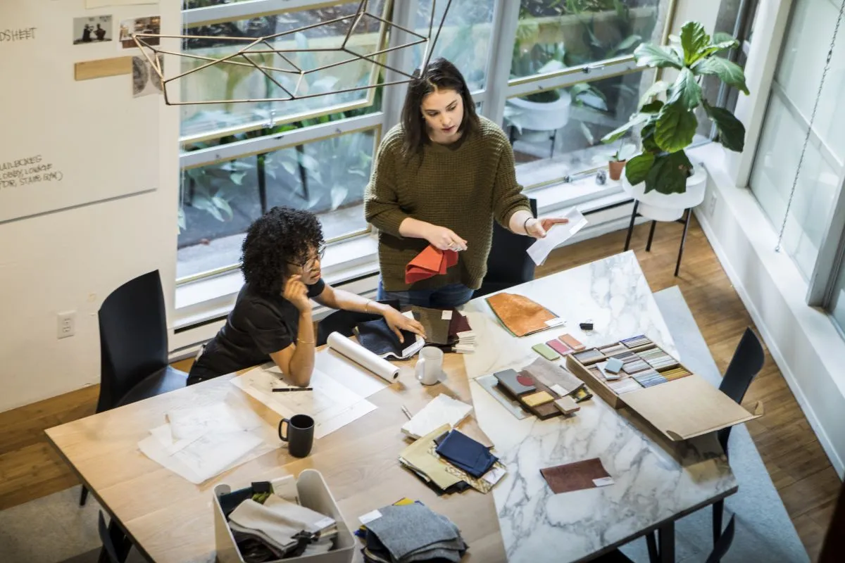 Two women working at the Annex table.