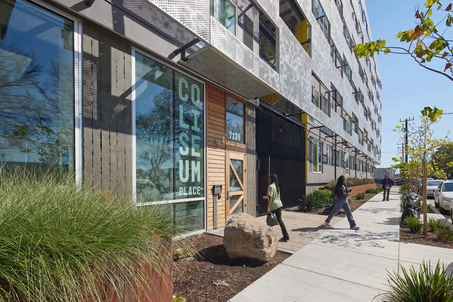 Exterior view of the front entrance to Coliseum Place in Oakland, California.