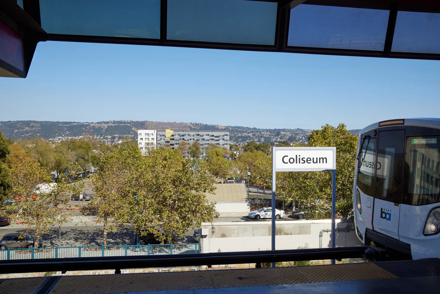Wide shot of Coliseum Place taken from BART in Oakland, California.