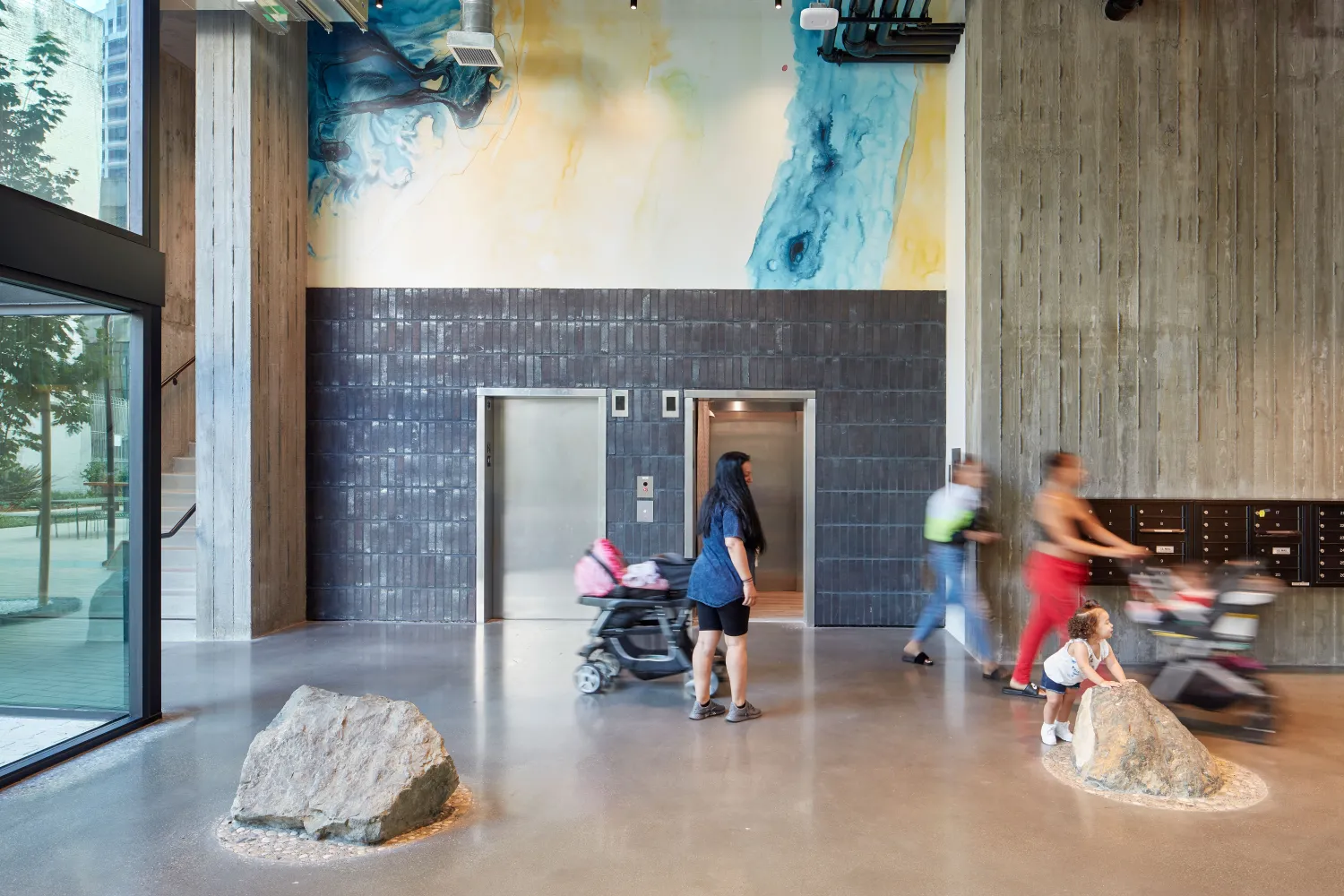 Entry lobby and elevators inside 222 Taylor