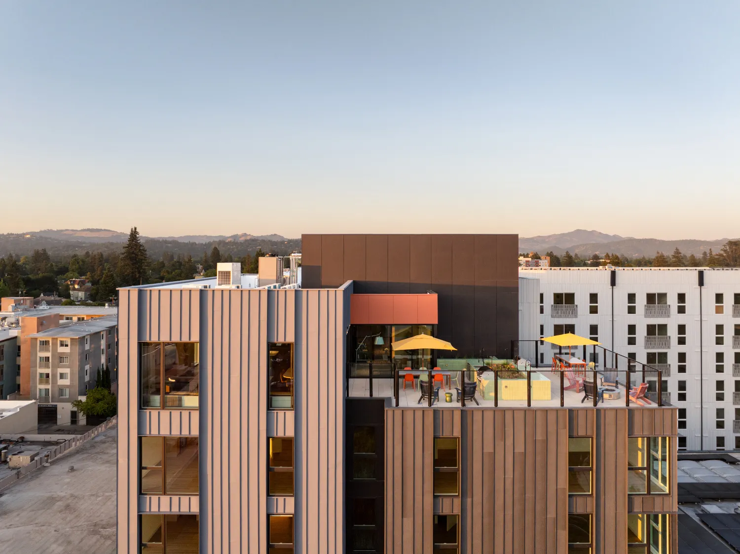 Birds eye view of the roof deck at dusk.