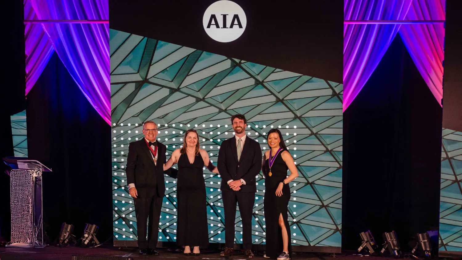 Two people accepting an award.