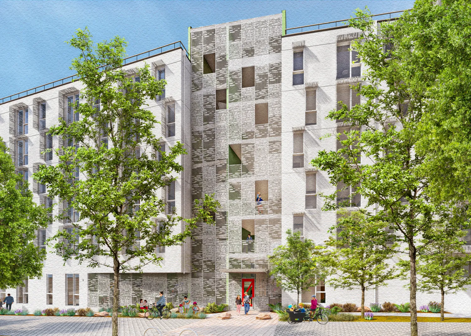 White 6 story building with trees in foreground 