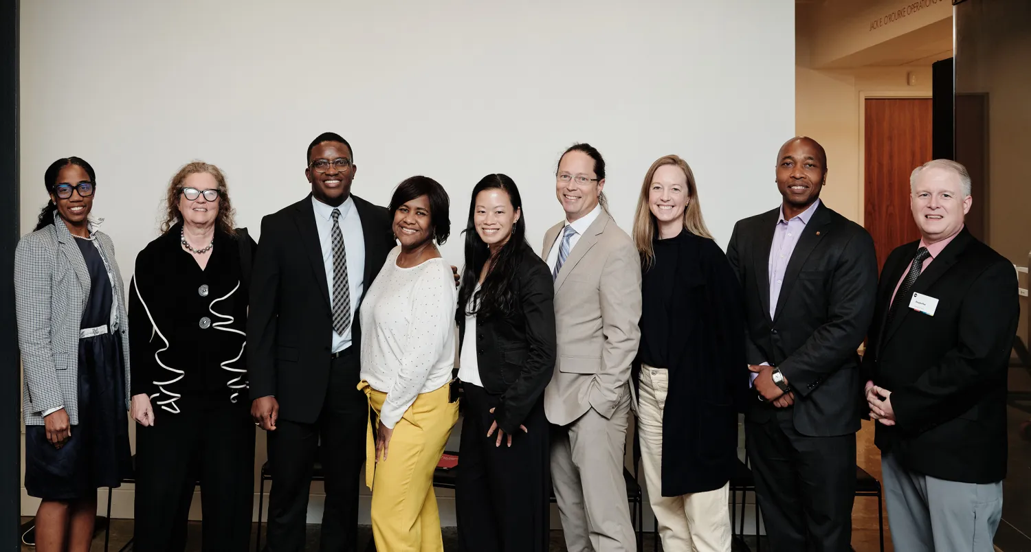 Group photos of 9 people at AIA HQ