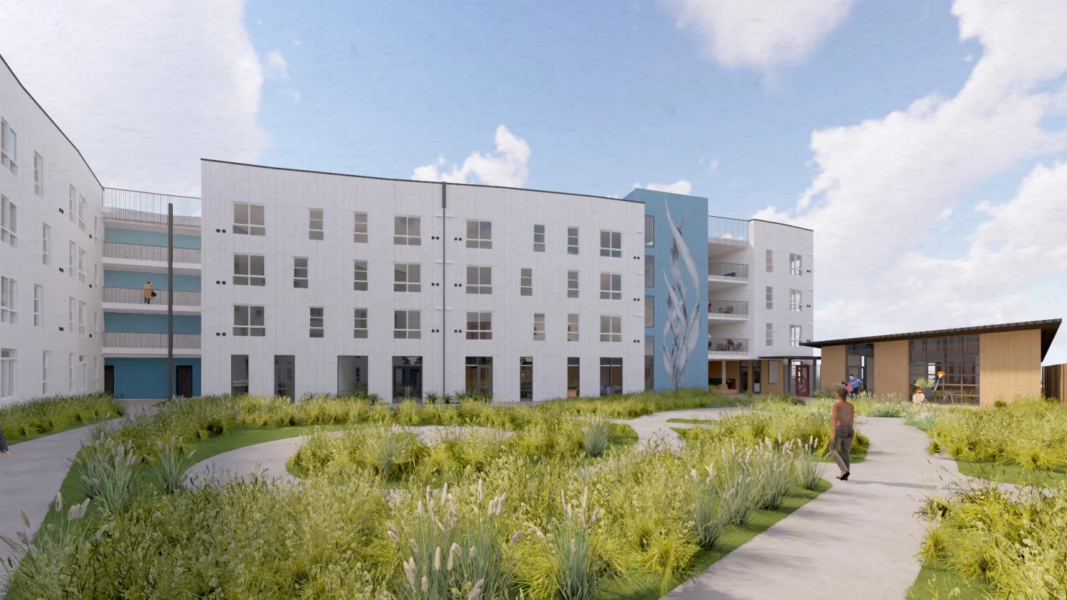 White building with blue and plants in foreground and blue sky background