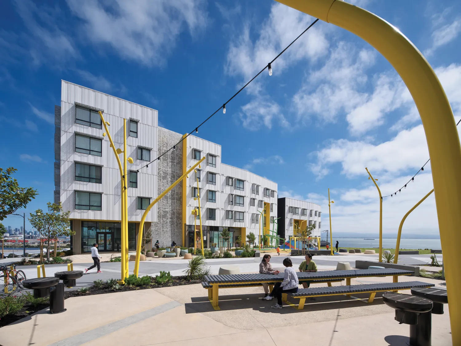 A view of the patios, public park and playground connecting the two buildings at Hunters View Phase III.