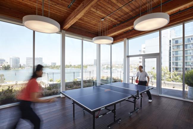 Residents playing table tennis in the wellness room in Lakeside Senior Housing in Oakland, Ca.