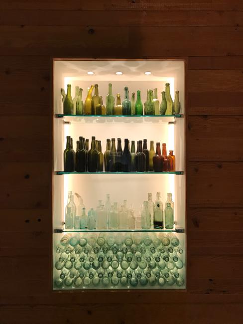 Reclaimed glass bottles on display at 855 Brannan in San Francisco.