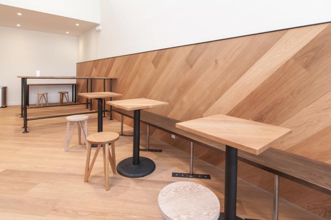 Interior seating tables at Saint Frank Coffee in San Francisco.